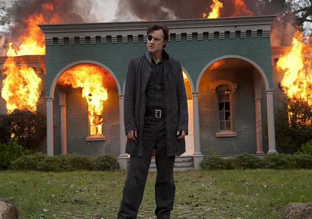The governor from The Walking Dead, burning down a house