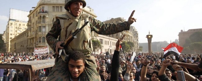 Egyptian soldier carried on the shoulders of protester