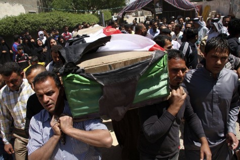 Iraqis carrying a coffin