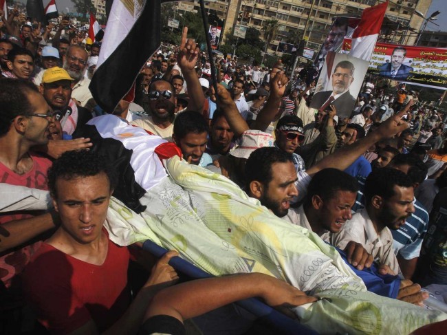 massacre-in-egypt-at-least-51-morsi-supporters-killed-in-shooting-at-army-barracks