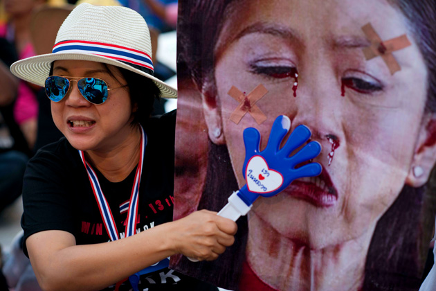 Thai Protester with Picture of PM thai crisis
